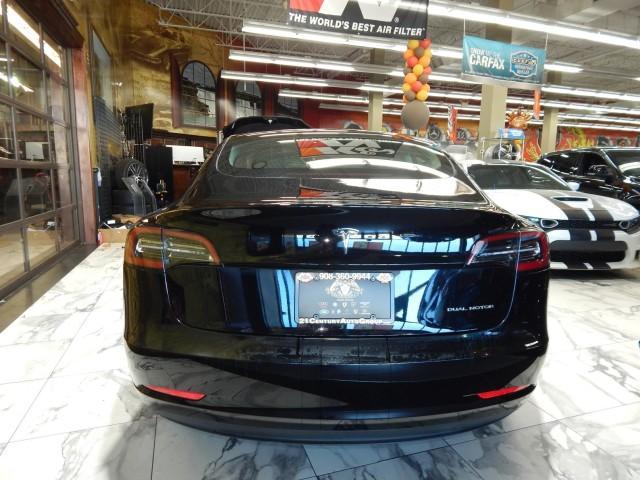 used 2023 Tesla Model 3 car, priced at $30,000