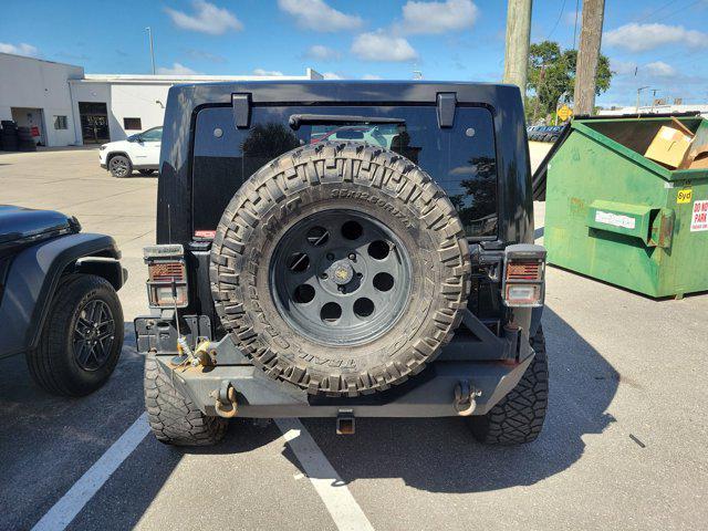 used 2011 Jeep Wrangler Unlimited car, priced at $10,895