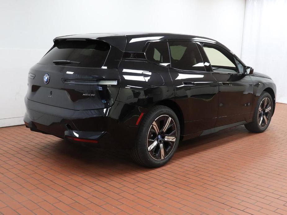 new 2024 BMW iX car, priced at $97,095