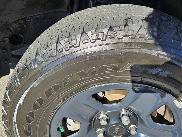 used 2023 Jeep Wrangler car, priced at $18,000