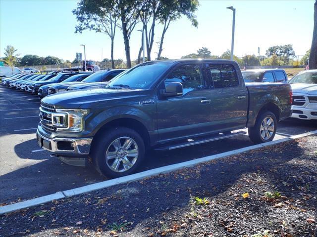 used 2018 Ford F-150 car, priced at $28,027