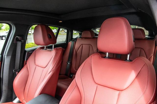 used 2025 BMW X4 car, priced at $50,992