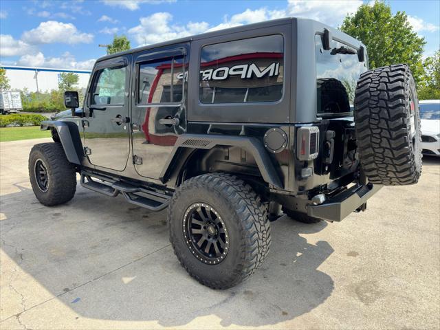 used 2013 Jeep Wrangler Unlimited car, priced at $16,900