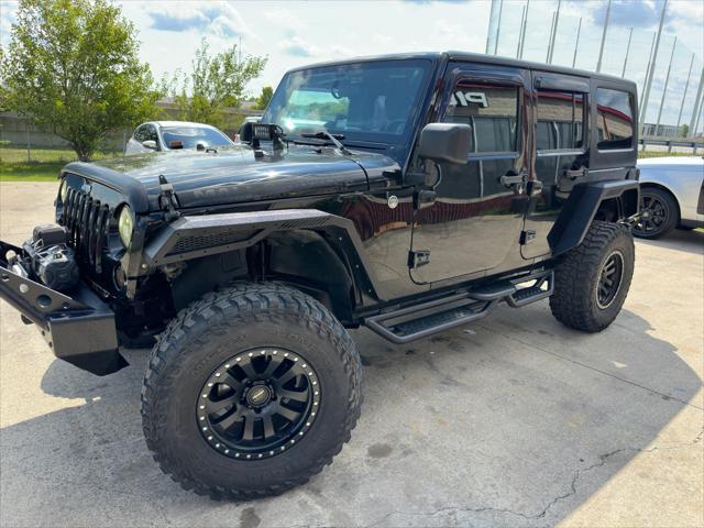 used 2013 Jeep Wrangler Unlimited car, priced at $16,900