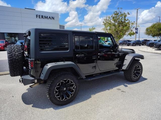 used 2015 Jeep Wrangler Unlimited car, priced at $13,487