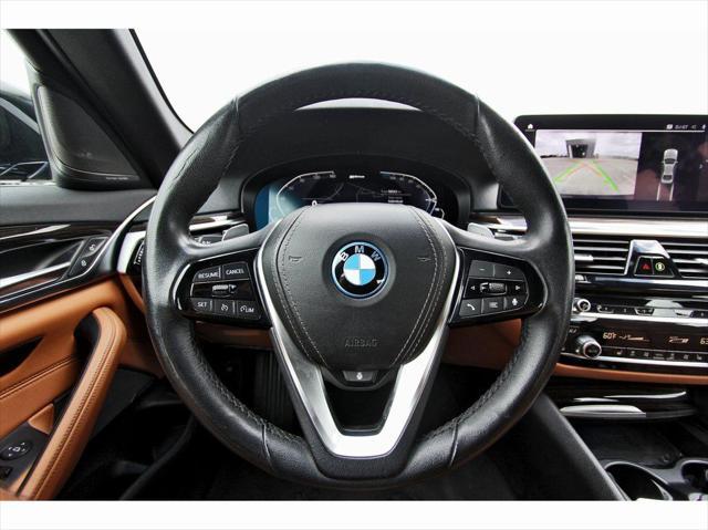 used 2023 BMW 530e car, priced at $33,561