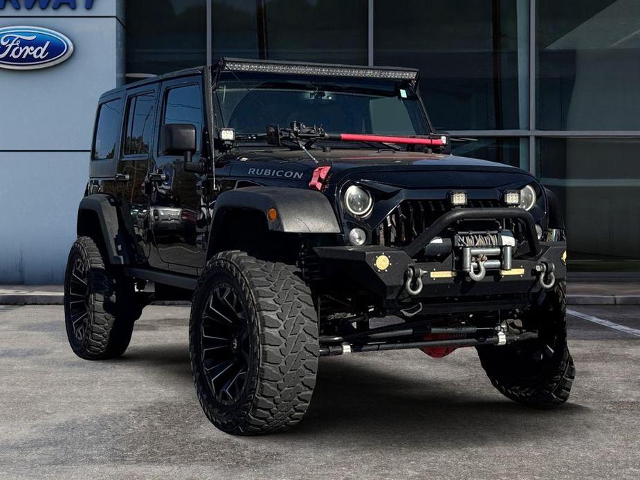 used 2015 Jeep Wrangler Unlimited car, priced at $22,497