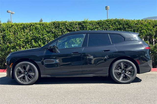 used 2024 BMW iX car, priced at $74,999