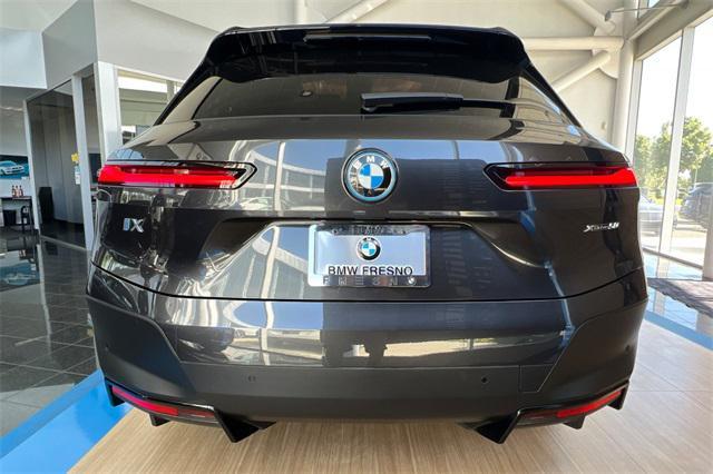 used 2024 BMW iX car, priced at $74,999
