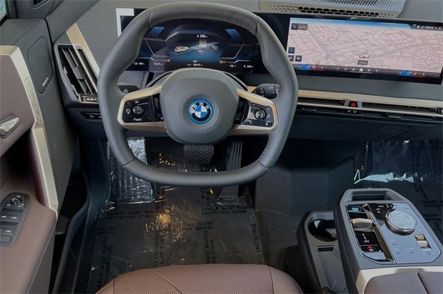 new 2025 BMW iX car, priced at $92,555