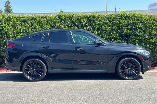 used 2023 BMW X6 car, priced at $55,999