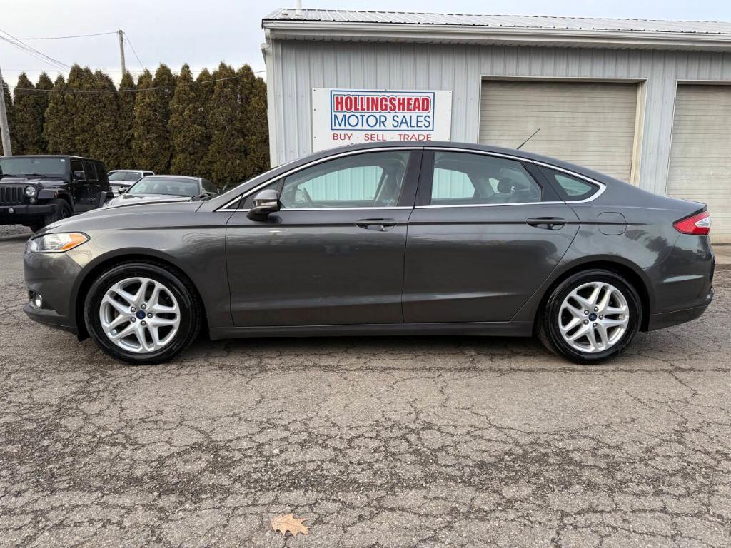 used 2016 Ford Fusion car, priced at $7,995