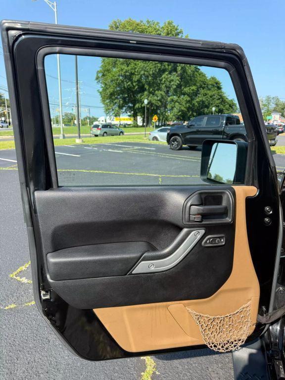 used 2014 Jeep Wrangler Unlimited car, priced at $15,295