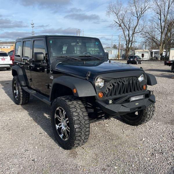 used 2011 Jeep Wrangler Unlimited car, priced at $16,489