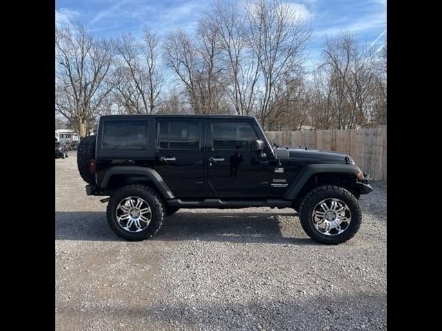 used 2011 Jeep Wrangler Unlimited car, priced at $16,489