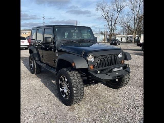 used 2011 Jeep Wrangler Unlimited car, priced at $16,489