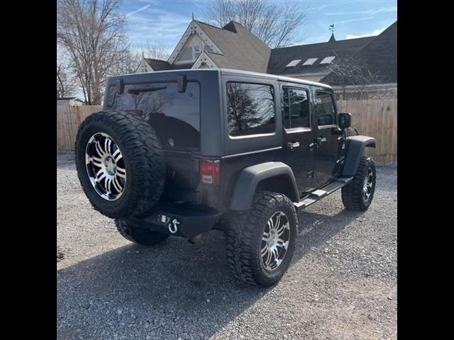 used 2011 Jeep Wrangler Unlimited car, priced at $16,489