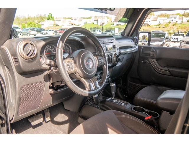 used 2014 Jeep Wrangler Unlimited car, priced at $23,874
