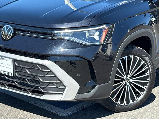 used 2025 Volkswagen Taos car, priced at $23,616