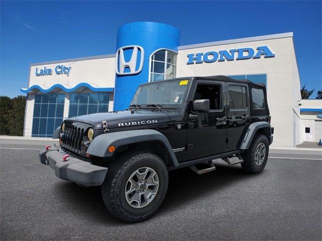 used 2013 Jeep Wrangler Unlimited car, priced at $19,596