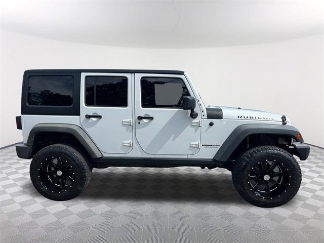 used 2014 Jeep Wrangler Unlimited car, priced at $19,732