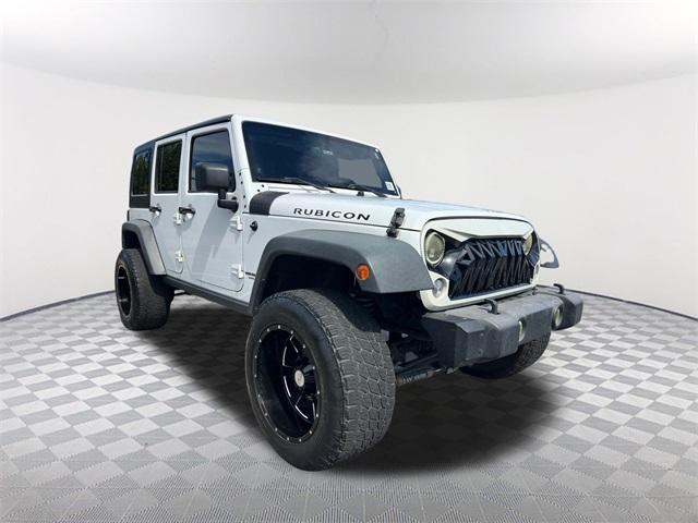 used 2014 Jeep Wrangler Unlimited car, priced at $19,732