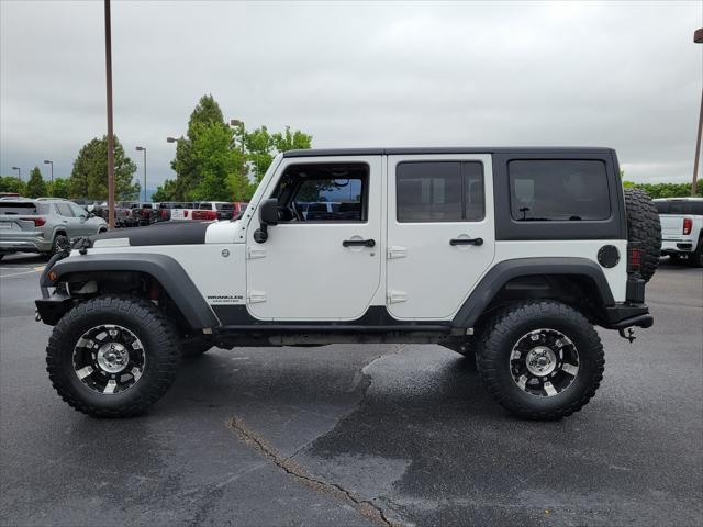 used 2012 Jeep Wrangler Unlimited car, priced at $17,869