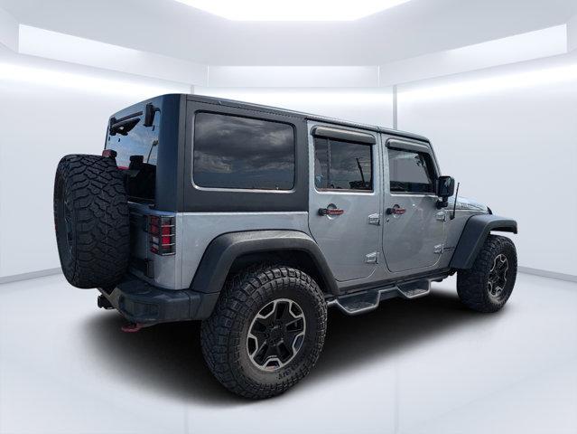 used 2014 Jeep Wrangler Unlimited car, priced at $19,697