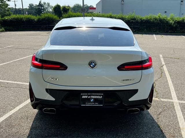 used 2025 BMW X4 car, priced at $54,990