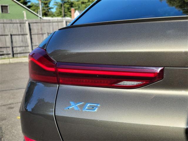 used 2023 BMW X6 car, priced at $42,997