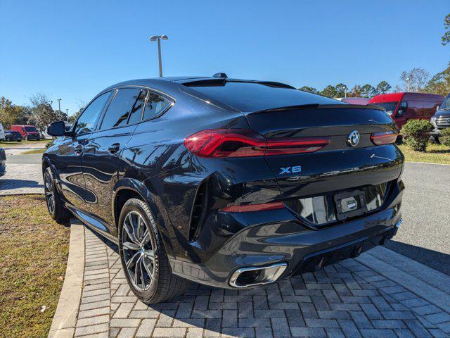 used 2024 BMW X6 car, priced at $65,378