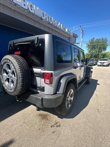 used 2015 Jeep Wrangler Unlimited car, priced at $16,998