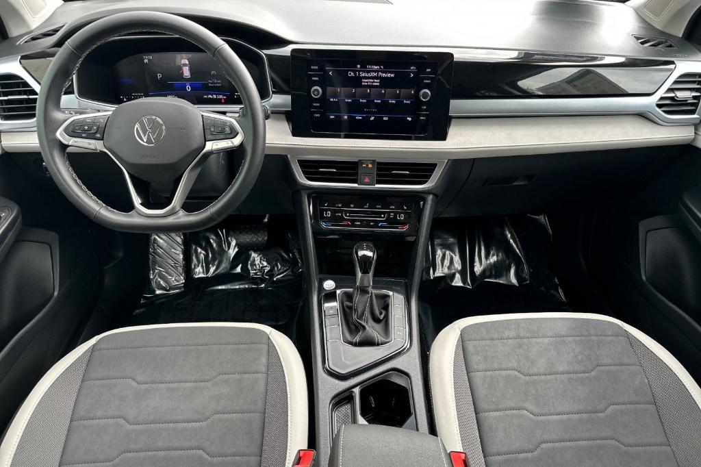 used 2025 Volkswagen Taos car, priced at $26,615