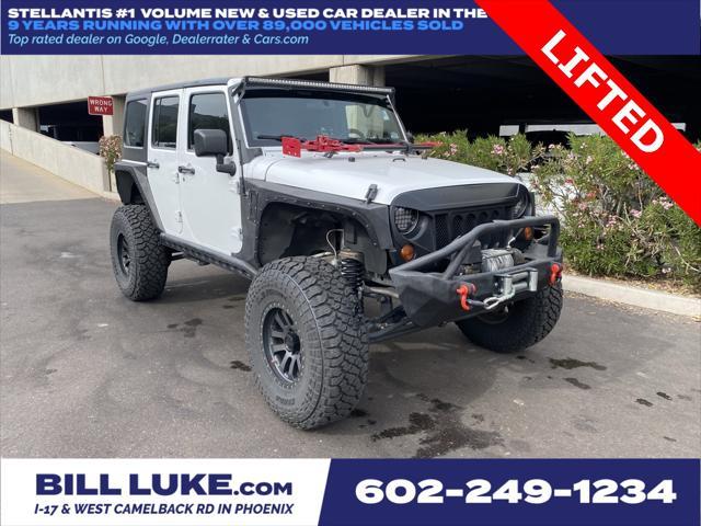 used 2012 Jeep Wrangler Unlimited car, priced at $16,973