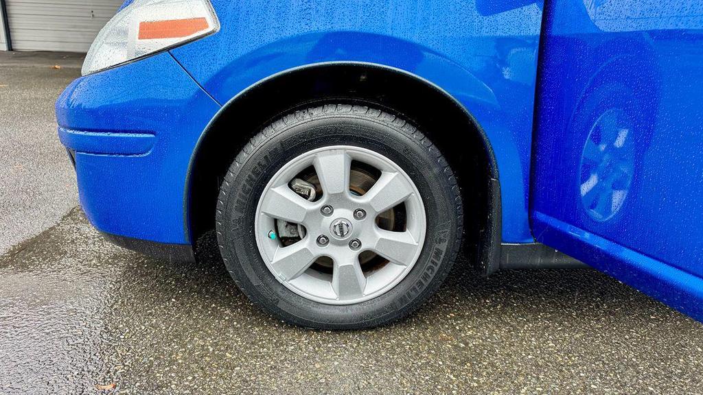 used 2009 Nissan Versa car, priced at $5,499