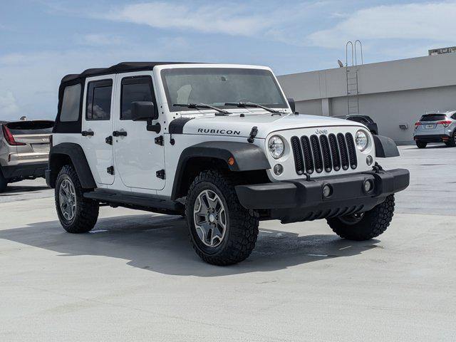 used 2016 Jeep Wrangler Unlimited car, priced at $26,258