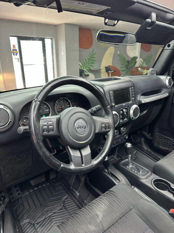 used 2012 Jeep Wrangler Unlimited car, priced at $12,999