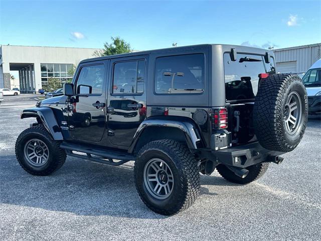 used 2014 Jeep Wrangler Unlimited car, priced at $21,880