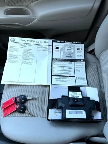 used 2012 Nissan Versa car, priced at $6,950