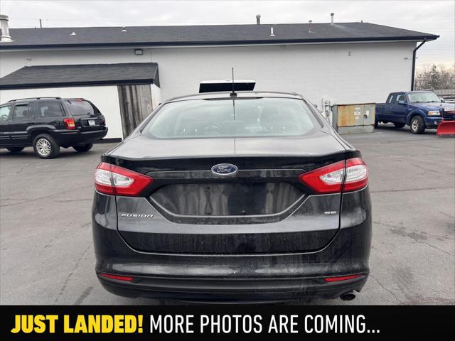 used 2014 Ford Fusion car, priced at $7,990