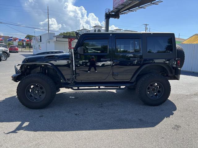 used 2012 Jeep Wrangler Unlimited car, priced at $13,999