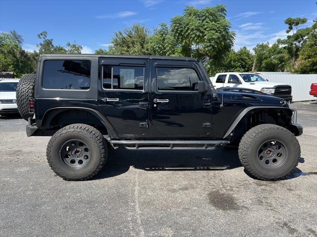 used 2012 Jeep Wrangler Unlimited car, priced at $13,999