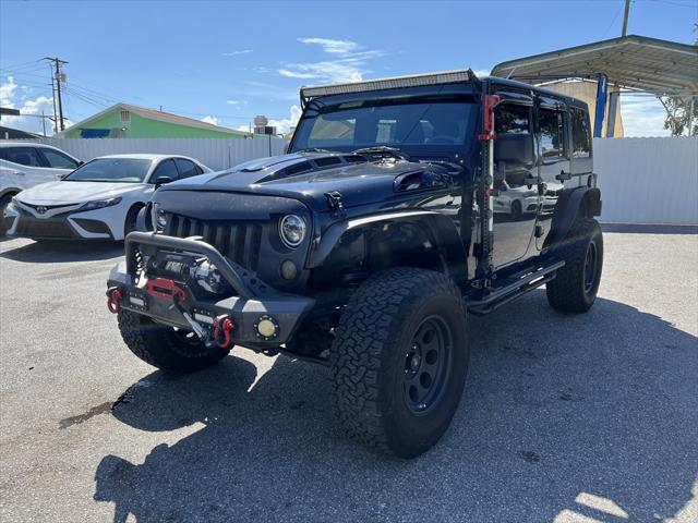 used 2012 Jeep Wrangler Unlimited car, priced at $13,999