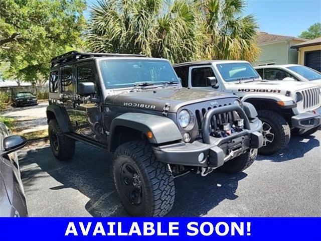 used 2014 Jeep Wrangler Unlimited car, priced at $28,491