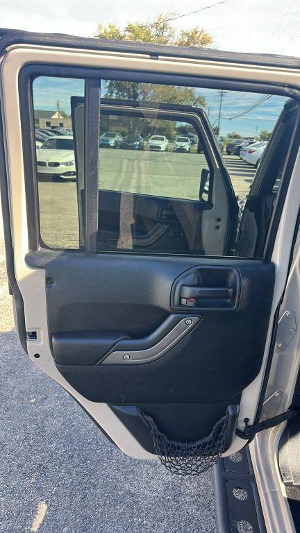 used 2016 Jeep Wrangler Unlimited car, priced at $17,779