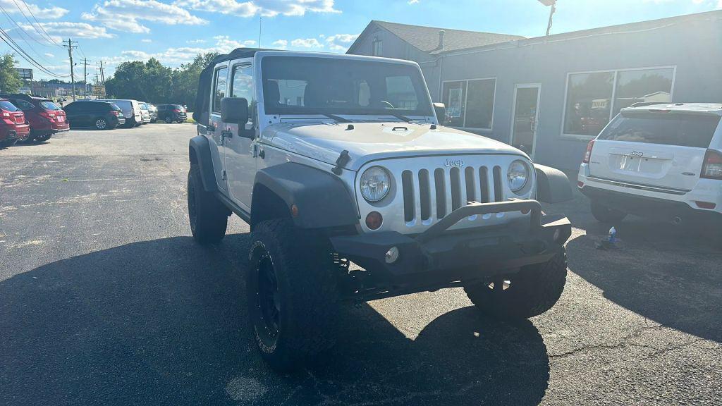 used 2011 Jeep Wrangler Unlimited car, priced at $12,995