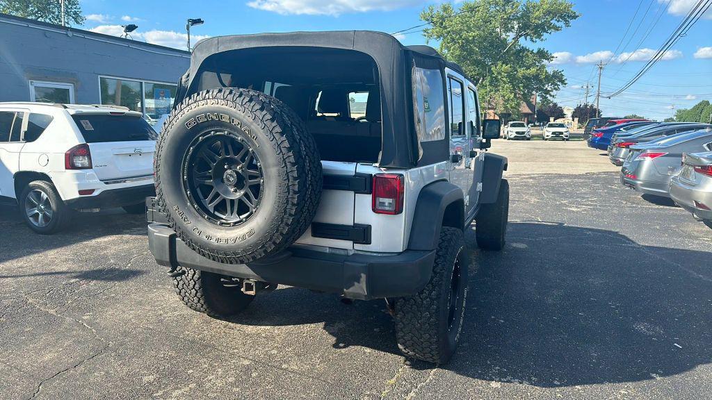 used 2011 Jeep Wrangler Unlimited car, priced at $12,995