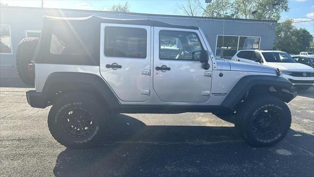 used 2011 Jeep Wrangler Unlimited car, priced at $12,495