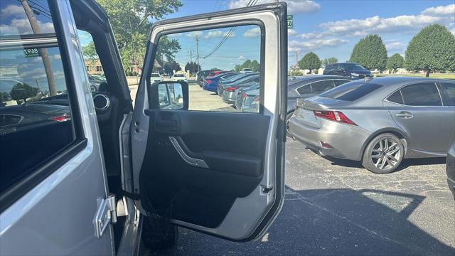 used 2011 Jeep Wrangler Unlimited car, priced at $12,495