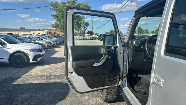 used 2011 Jeep Wrangler Unlimited car, priced at $12,495